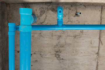 water pipes pvc plumbing under cement ceiling of second floor