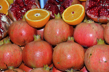 Tropical fruits sold on the marketplace
Pomegranates and oranges for sale

