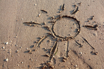 Sandy beach with hand drawn sun background