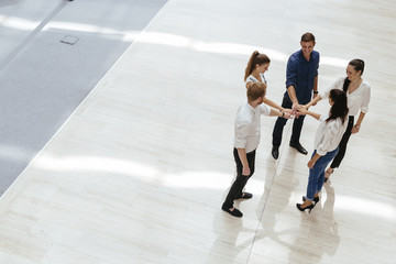 Business teamwork. People with joined hands. Union