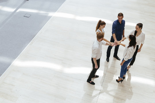 Business teamwork. People with joined hands. Union