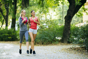 Athletic women jogging in nature