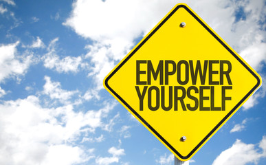 Empower Yourself sign with sky background