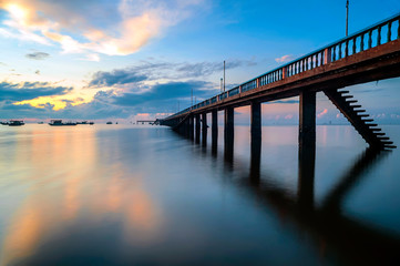Fototapeta premium The bridge on the beach in sunrise, Tien Giang province, Vietnam