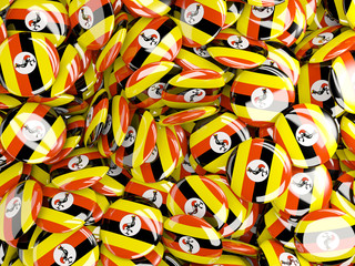 Fototapeta na wymiar Background with round pins with flag of uganda