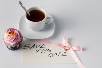 Pink cupcake with tea cup