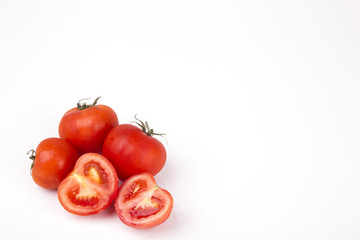 Red tomatoes on a white background..