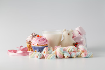 Heap of colored sweets on white background