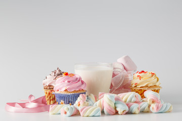 Heap of colored sweets on white background