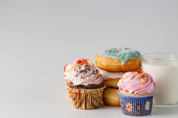 Colored donuts on white plain background