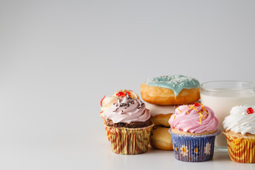 Colored donuts on white plain background