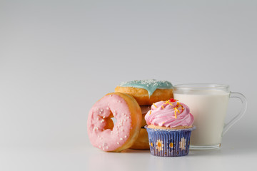 Colored donuts on white plain background