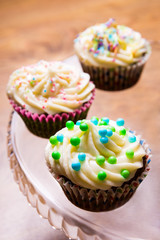 tasty colorful cupcakes with butter cream
