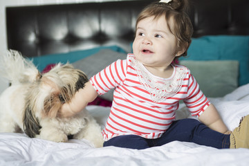 one year old girl in bed