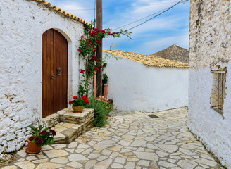 A picturesque street in Afionas Garden Village, Corfu, Greece. - 94156502