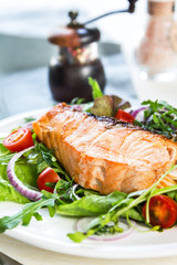 Salmon steak with salad