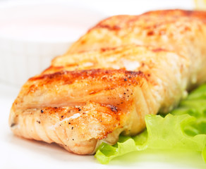 grilled salmon on white plate