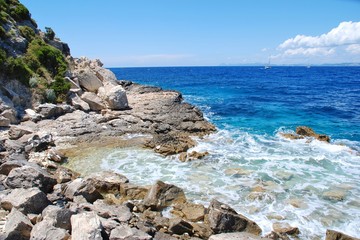 The rocky coastline near Arkoudaki beach at Lakka on the Greek island of Paxos.