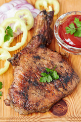 Grilled steak on wooden chopping board,top view