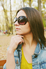 Fototapeta premium Hipster beautiful girl in jeans jacket . Fashion girl posing with jacket