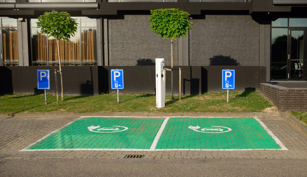 Charging point for electric cars and plug-in hybrids at designated car parking.