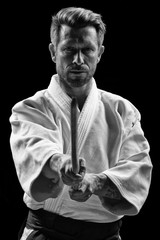 low key portrait of aikido master - obrazy, fototapety, plakaty