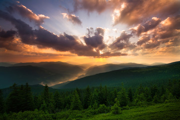 Beautiful sunrise in mountains, the sky in the sunshine
