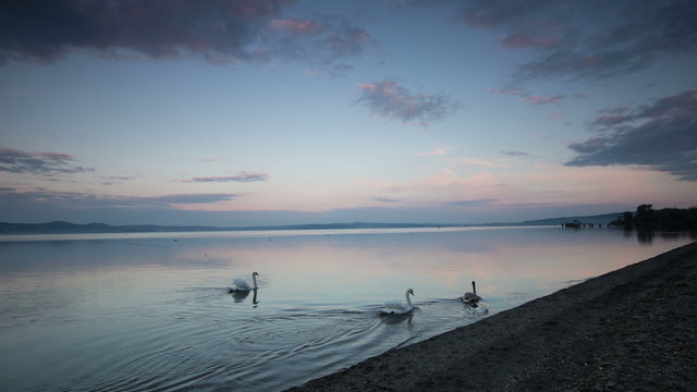 Timelapse clip; a fast clouds passage over bracciano Lake, near Rome, italy from day to night
