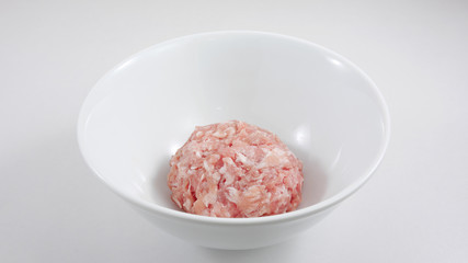 The minced pork in the white bowl. (2)
