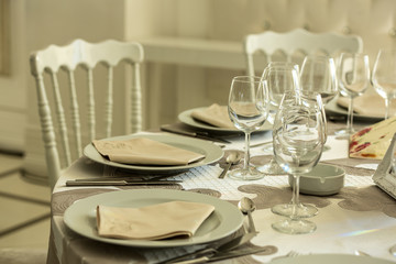 Wedding table arrangements with glases and plates