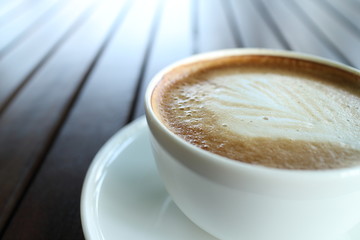 Cup of art latte or cappuccino coffee