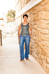 woman on the background of ancient town. Crete