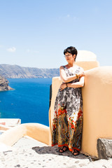 Beautiful  woman in Oia town on Santorini island, Greece