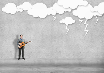 Businessman play guitar