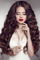 Healthy long hair. Girl makeup. Beautiful Brunette. Red Lips. Pe