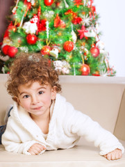 Little boy near Christmas tree