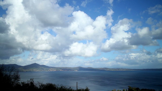 Timelapse clip; a fast clouds passage over bracciano Lake, near Rome, italy from day to night
