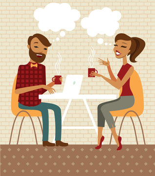 Young couple talking and drinking coffee in a cafe