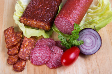 Sausage of salami on a cutting board