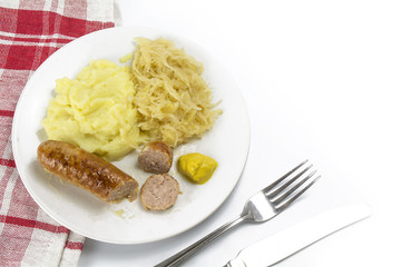 Fried sausage with pickled cabbage, mashed potatoes and mustard