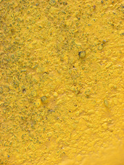 yellow paint on asphalt background