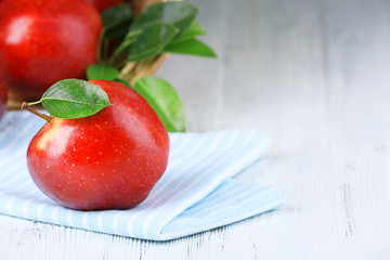 Ripe red apples on table close up