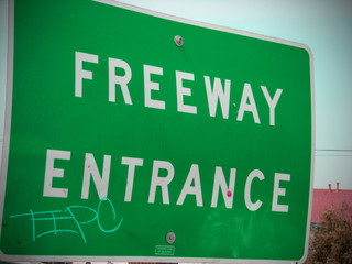 Fototapeta premium freeway entrance sign with graffiti