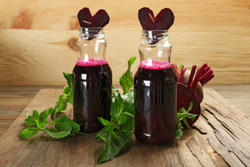 Fresh beet juice on wooden table, closeup