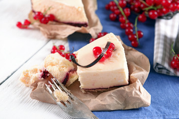 Tasty cheesecake with berries on table close up