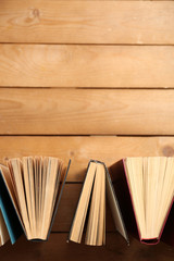 Heart of books, on wooden background