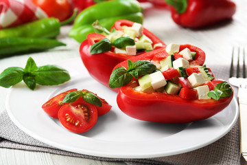 Fresh green salad in pepper on table close up