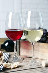 Still life of wine and bread on light background