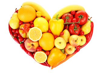 Colourful heart shaped fruit and vegetables composition isolated on white