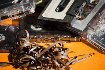 group of old cassette tapes on colored background